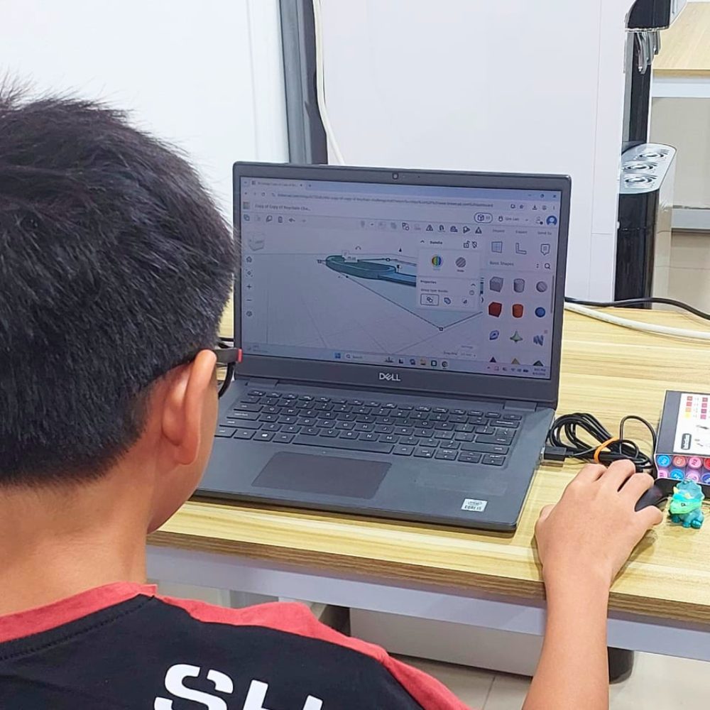 A child designing a 3D model at Kunoa