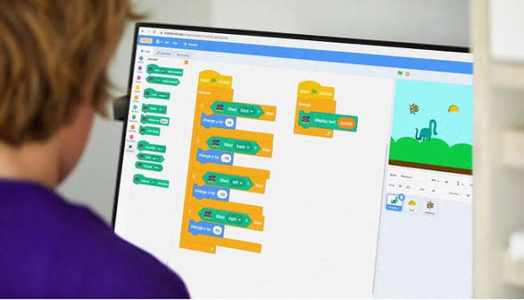 A child coding on a tablet